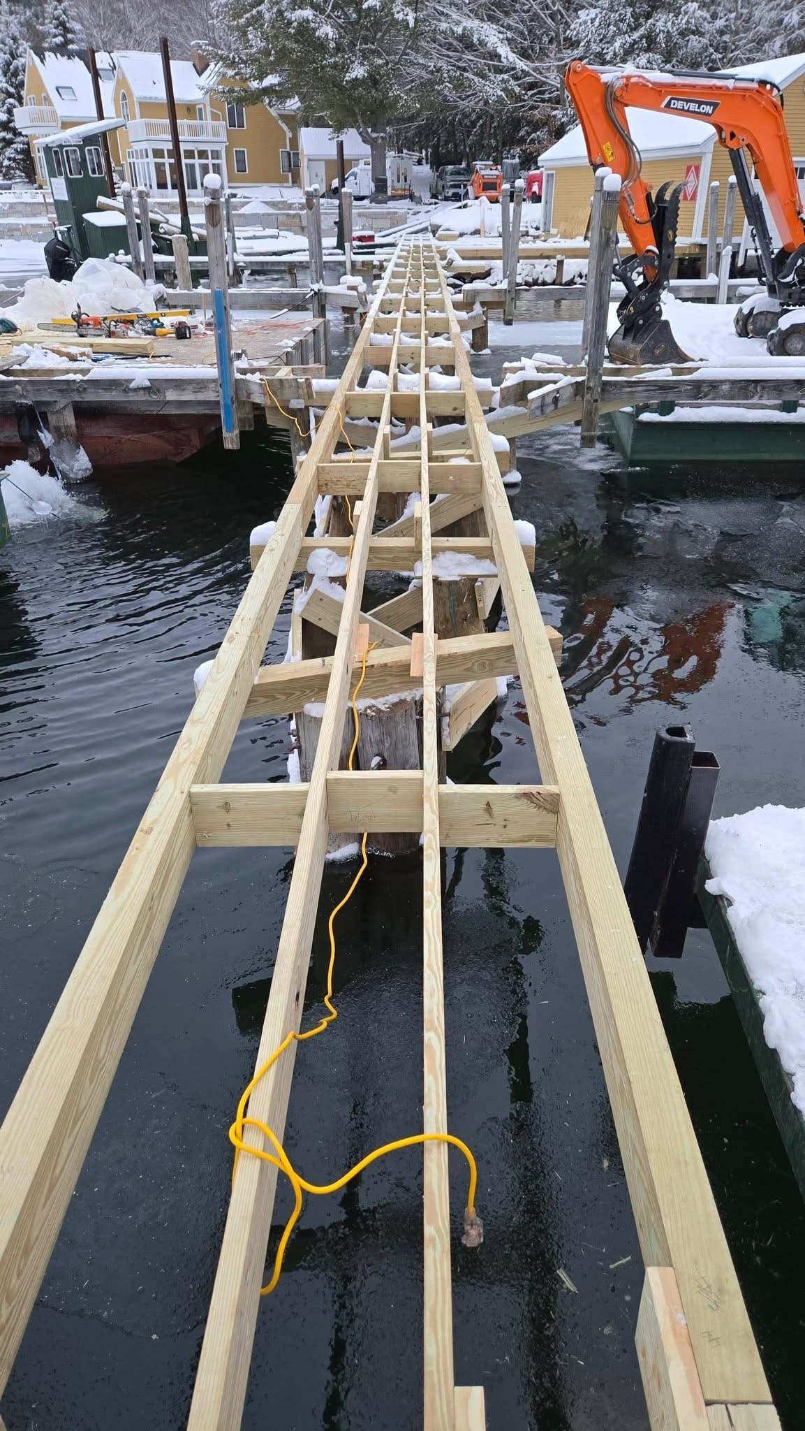 Long view down dock framing with composite deck panels visible
