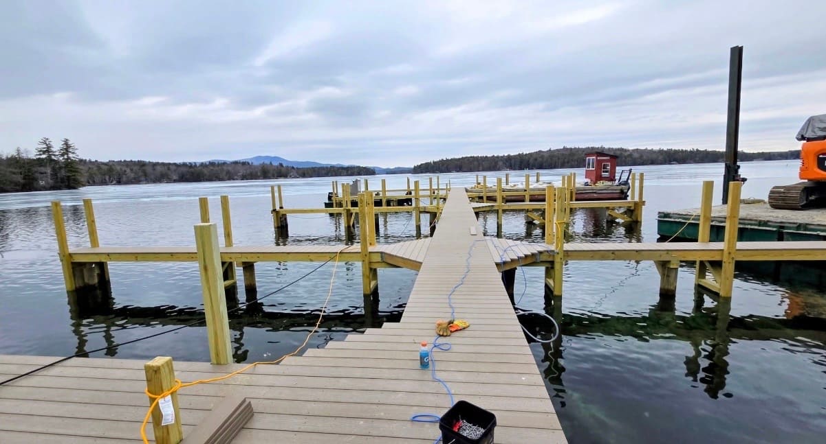 T-shaped multi-dock layout with composite decking under a cloudy sky
