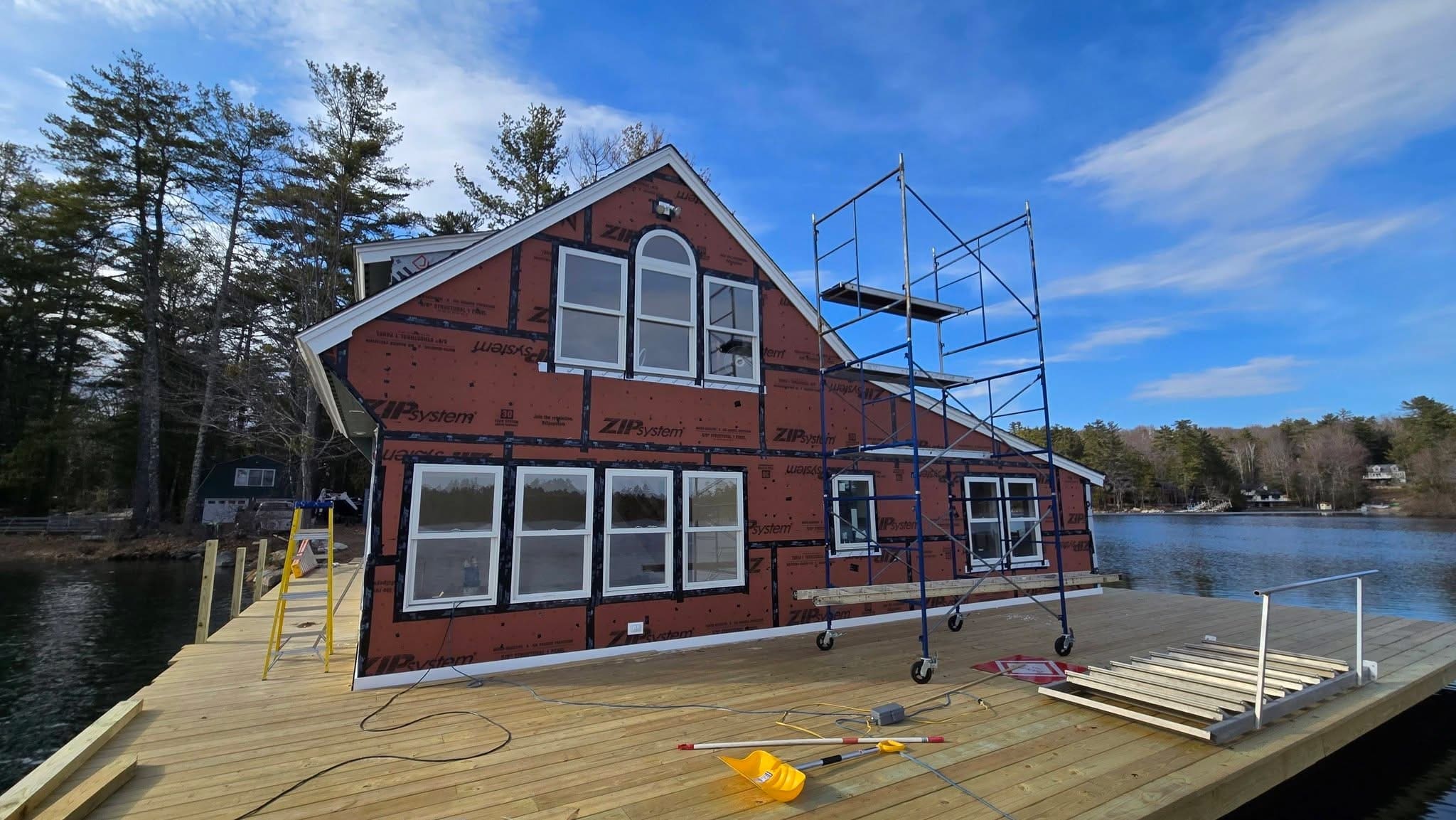 Lake house in mid-construction with ZIP-system sheathing and new deck